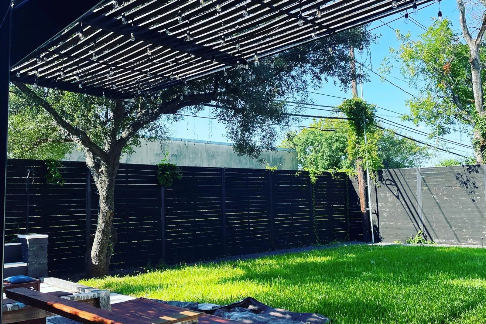 A bright, even turf lawn in a shaded courtyard